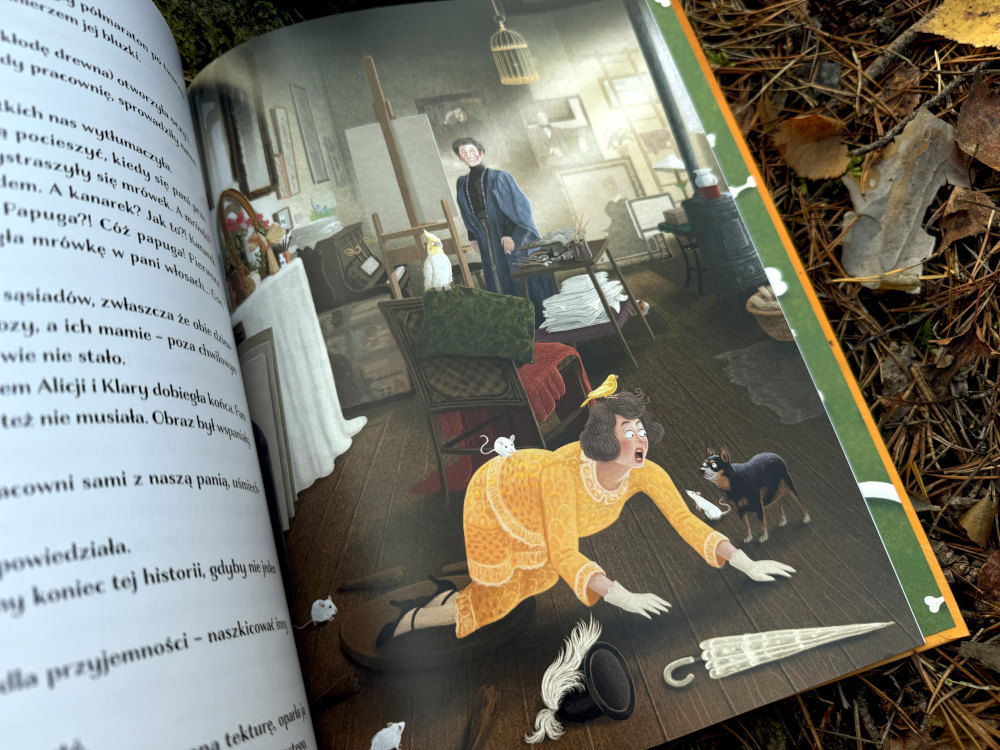 Scena z książki Psyjaciele przedstawiająca artystkę Olgę Boznańską w pracowni z papugą i psem Bobym – barwna ilustracja pełna szczegółów.