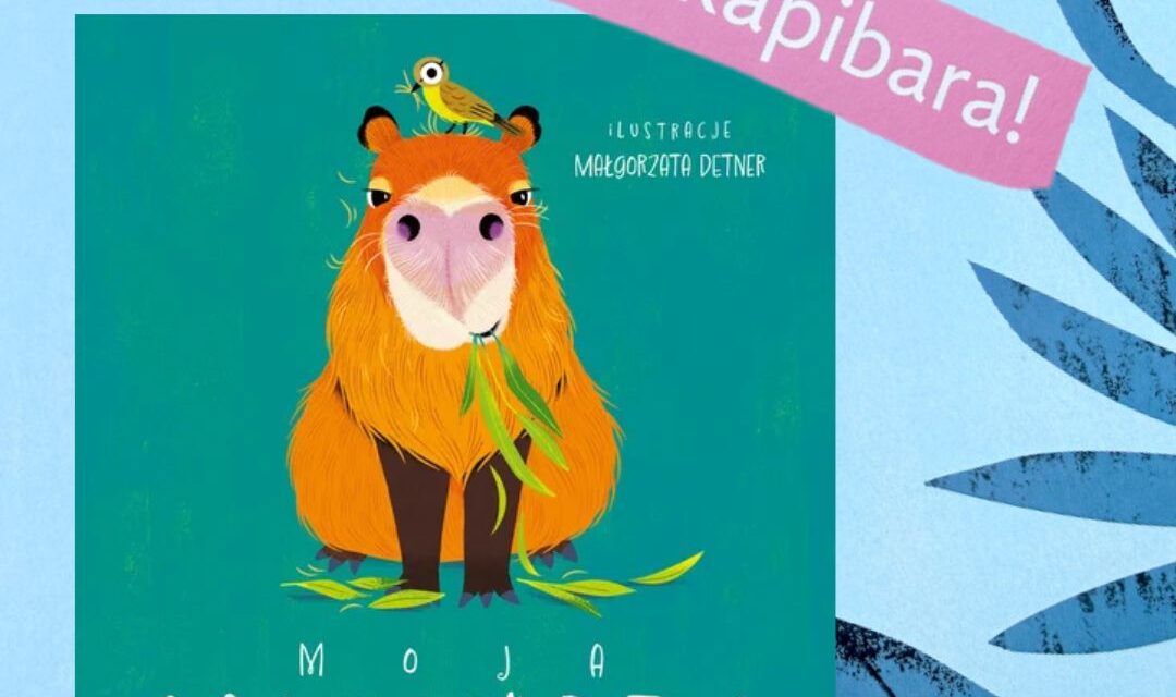 Okładka twardej książeczki Moja kapibara: uśmiechnięta pomarańczowa kapibara z młodym na zielonym tle, prosty layout z białymi tekstami i geometrycznymi kształtami, format poziomy