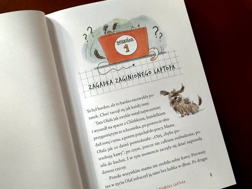 Ilustracja otwierająca pierwszy rozdział książki o zaginionym laptopie z rysunkami psa i znakami zapytania.
