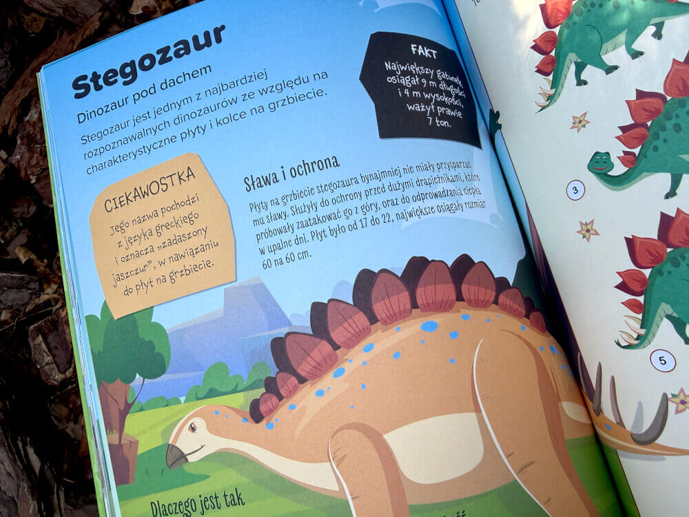 Kolorowa rozkładówka książki z ilustracją dinozaura, ciekawostkami i zadaniami dla dzieci