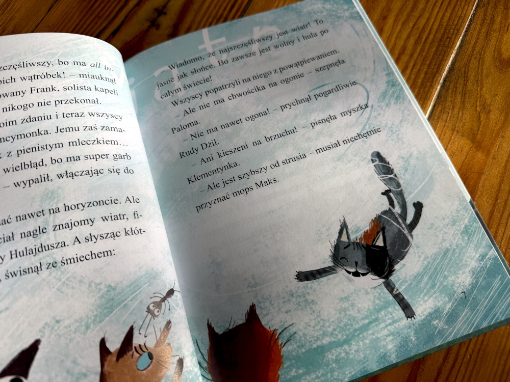 Ilustracja przedstawiająca powiew wiatru i postać sprytanego kota z książki Ancymonek na tropie szczęścia.
